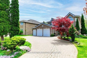 Custom Built Chiavatti Home, with a Triple Garage and Backing onto Ravine.