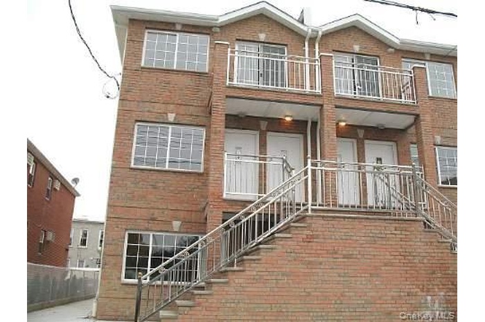 Entrance to property with brick siding