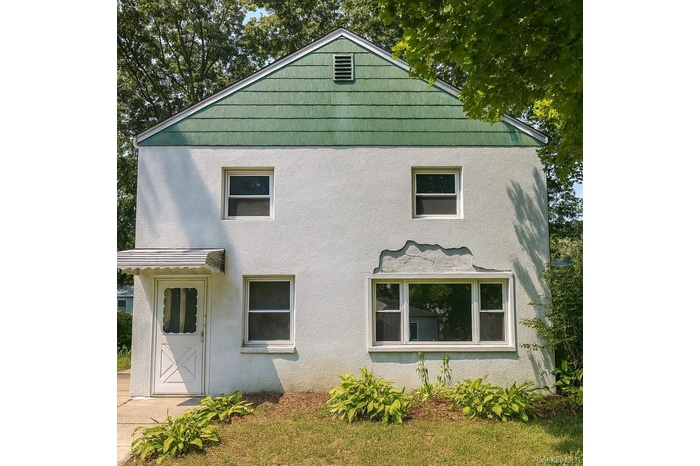 View of front of house with stucco siding