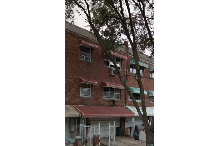 View of property with a garage