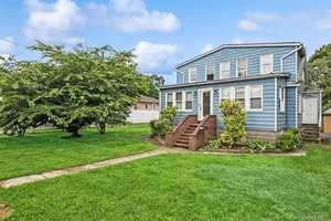 Situated on a spacious 86x235 lot, this 6 bedroom, 2 full bath home features a full basement with outside access.