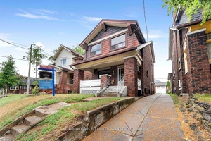 This charming red brick detached home sits on a wide 30 x 108 ft lot with a private drive for 4 5 cars, detached garage, and incredible potential inside and ...