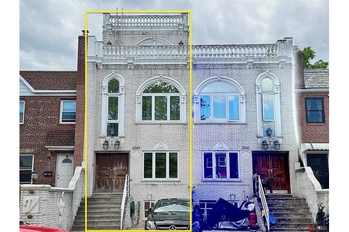 View of front facade with entry steps and brick siding