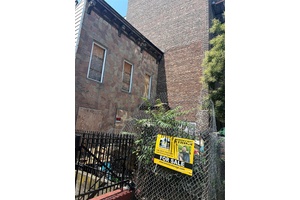 This 20x100 building has Approved plans for 4 Story 12 Units.