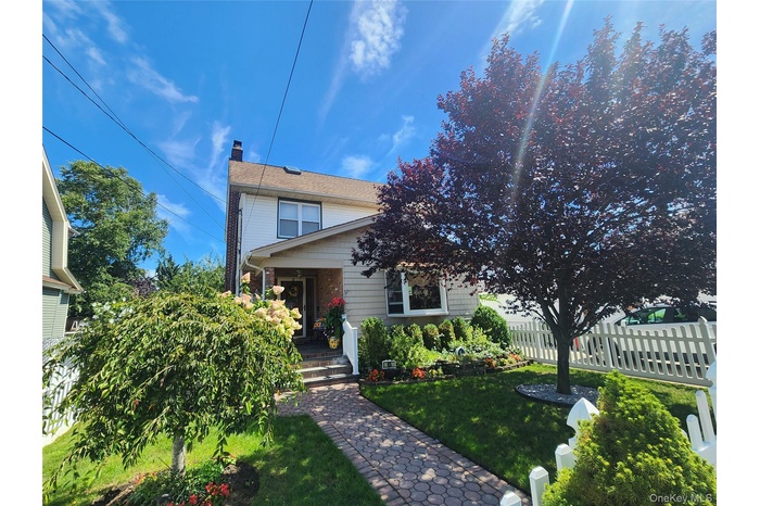View of front of house featuring a chimney