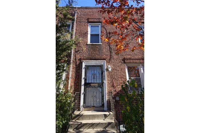 Entrance to property with brick siding