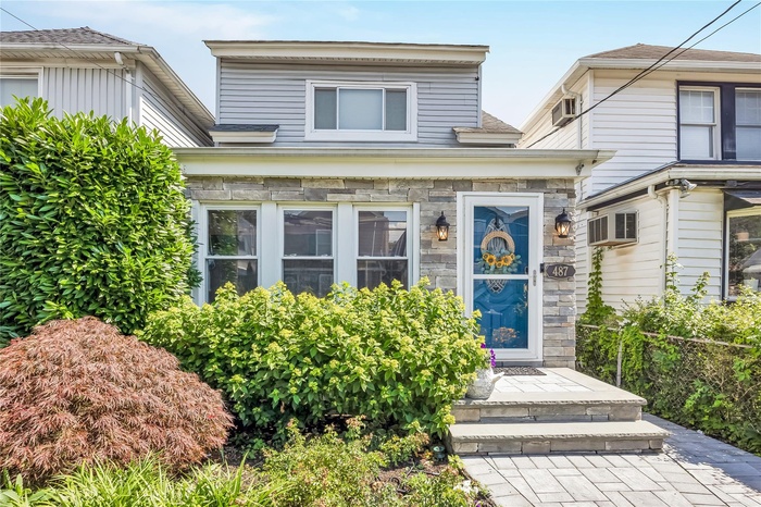 View of front of property featuring stone siding