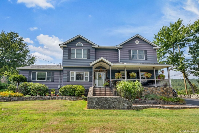 Front of property with beautiful hard and soft landscaping and front yard