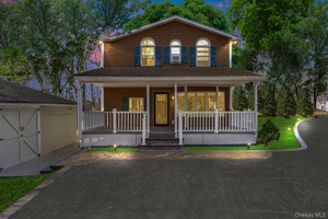 Welcome to 32 Giant Oak Rd, nestled in one of Ridge s most tranquil and sought after neighborhoods.