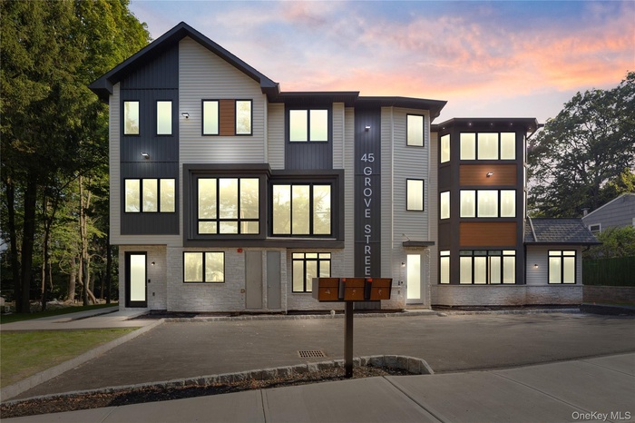Modern home featuring brick siding