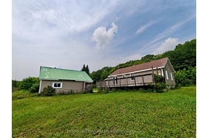 Experience The Best Of Both Worlds With Country Living In The City At 1521 Four Mile Lake Road !
