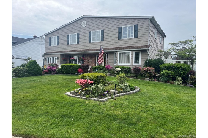Traditional-style home with a front lawn