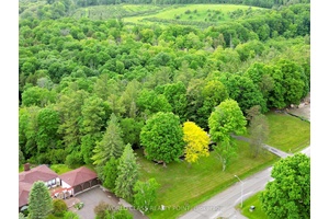 This Fully Renovated Bungalow Sits On 2 Acres Of Verdant Beauty That Backs Onto Ravine.