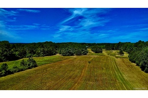 Discover your own 50 acre sanctuary in the Hudson Valley, a landscape of rolling meadows, a peaceful pond, a winding stream, and two timeless period barns that set the stage ...