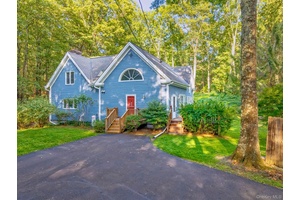 Nestled on a full acre of beautifully landscaped grounds, this 3 bedroom, 2 bath home offers timeless charm with thoughtful updates.
