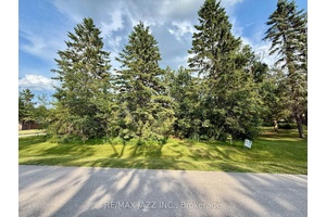 Build your dream home on this exceptional waterfront lot on Canal Lake !