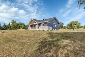 Welcome to 4645 McNeely Road a stunning 2023 built bungalow set on nearly 1.