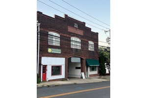 Own a piece of history in the center of Locust Valley, 11, 000 sft building, brick construction, new roof and gutters.
