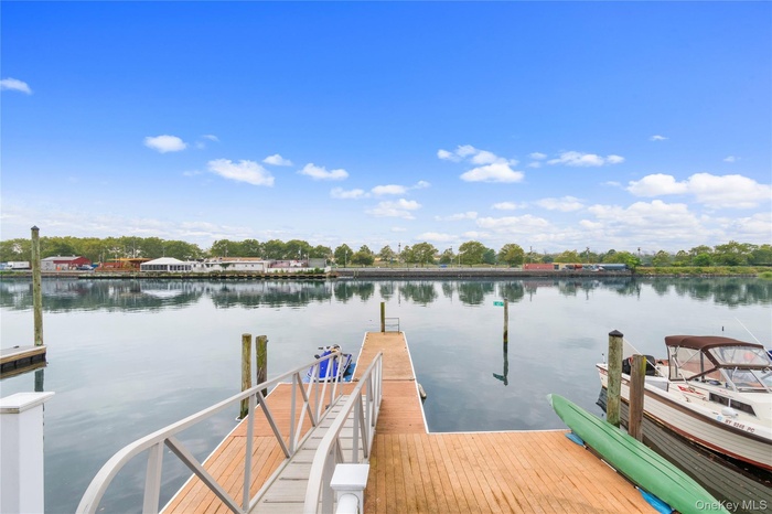Dock area featuring a water view