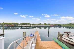 Stunning waterfront 2 family used as 1 family perfect for those who appreciate water activities and daily sunset views.