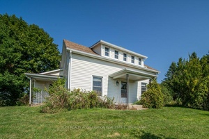 This charming 3 bedroom, 3 bathroom home, built in 1870, sits on 7 picturesque acres along the shore of Hay Bay.