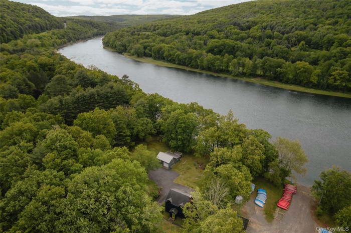 Bird's eye view of a heavily wooded area and a large body of water