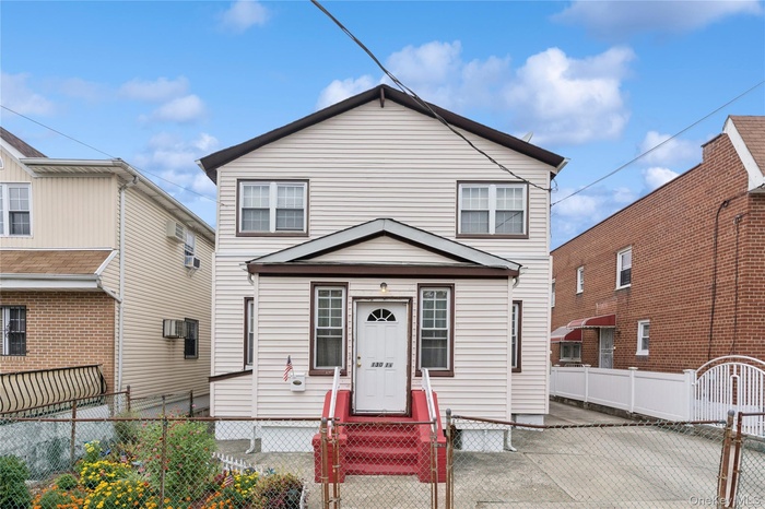 View of front of home with a gate and a fenced front yard