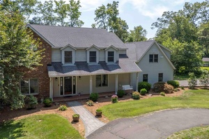 Welcome home ! This large colonial style home features 4 bedrooms, 2.