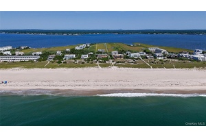 Discover the pinnacle of Hamptons luxury living at this extraordinary waterfront estate on prestigious Dune Road in Westhampton.
