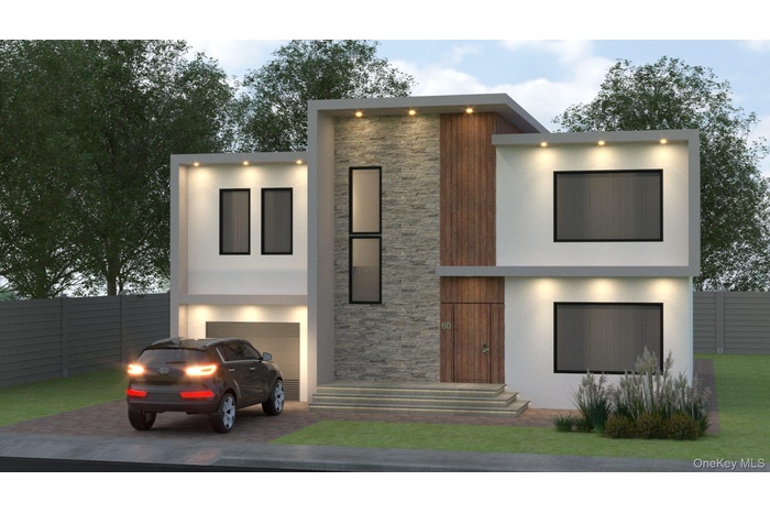 Contemporary house featuring stone siding, stucco siding, decorative driveway, and an attached garage