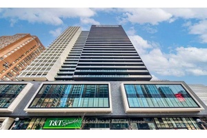 Partial Furnished 2 Bedroom Unit including bed in each room and desk in the smaller room.