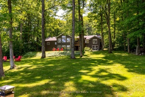 Welcome to this stunning waterfront bungalow offering luxurious living.