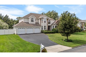 Welcome to Island Estates, where this impressive Colonial features 5 bedrooms and spacious living areas, complete with soaring ceilings and a striking staircase.