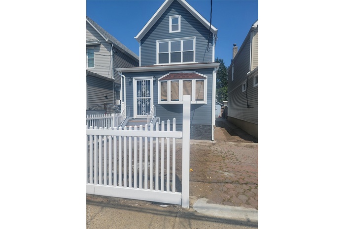 View of front of home with a fenced front yard