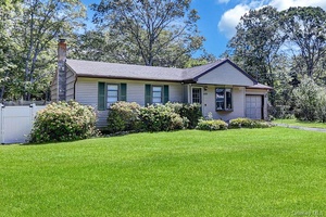 Beautifully maintained ranch with cathedral ceilings in living room and large bay window.