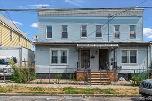 Discover this renovated two family property, perfect for investors or multi generational living.