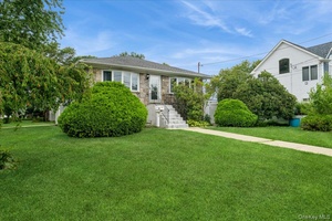 This home sits on a corner lot and offers a total of 5 bedrooms and 3 full bathrooms.