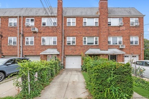 This is a Beautiful attached brick 2 family house located in the heart of Bayside.