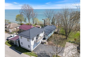 Nestled at the end of a quiet dead end street in the heart of Port Dovers picturesque lakeside community, this 1.