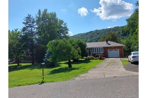 Welcome to 1 Tappan Drive, a charming lakefront home nestled in the Village of South Blooming Grove.