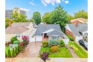 Welcome to this Oversized Split Level Home in Bayside Bay Terrace !