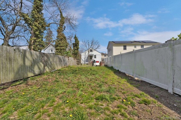 View of fenced backyard