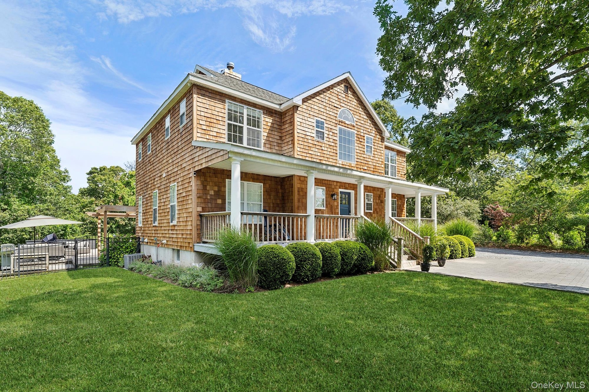 View of front of property with a porch and a chimney