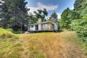 Discover a rare double lot 200ft x 150ft property situated on top of Mulmurs scenic hills.