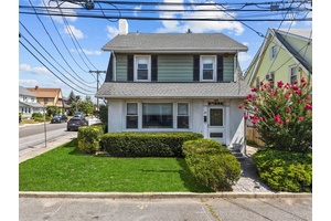 Welcome to 28 Crescent Street, a classic side hall Colonial style home nestled in Hewlett s esteemed School District 14.
