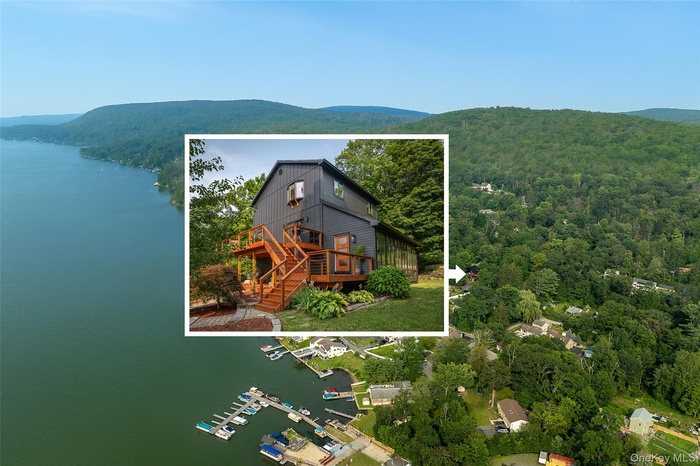 View from above of property featuring a water and mountain view and property parcel outlined