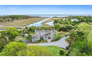 Nestled on 1. 05 acres with access to Tanners Neck Creek and bordering a nature reserve, this 5 bedroom, 3.