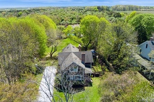 Explore this beautifully restored 4 bedroom, 2 bath farmhouse situated on highly desirable Oregon Road in the heart of North Fork wine country.