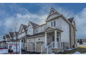 Stylish and spacious executive end unit townhome in a sought after family friendly community.