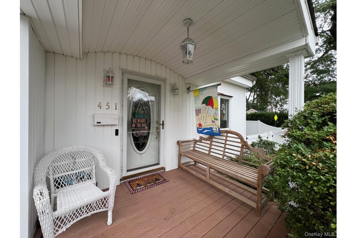 Property entrance with covered porch
